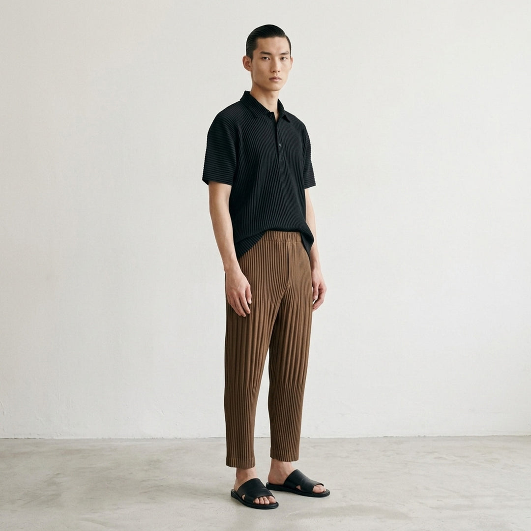 Homme Plissé Issey Miyake Color Pleats 2 pleated pants in teal, featuring all-over vertical pleating, elasticated waistband, and tapered cropped leg - lifestyle