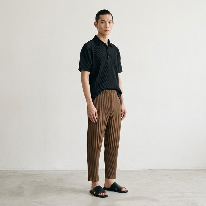 Homme Plissé Issey Miyake Color Pleats 2 pleated pants in teal, featuring all-over vertical pleating, elasticated waistband, and tapered cropped leg - lifestyle