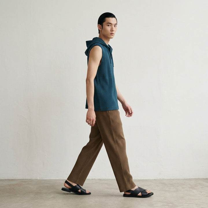 Homme Plissé Issey Miyake Color Pleats 2 pleated pants in teal with signature vertical steam pleats and elastic waistband, straight-leg silhouette, front view - lifestyle