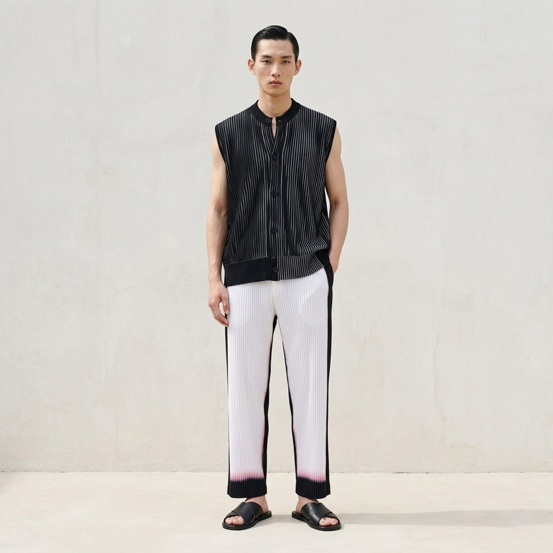 Homme Plissé Issey Miyake Framework : Chusen black pleated pants with a white gradient hem and elasticated waistband, front view - lifestyle