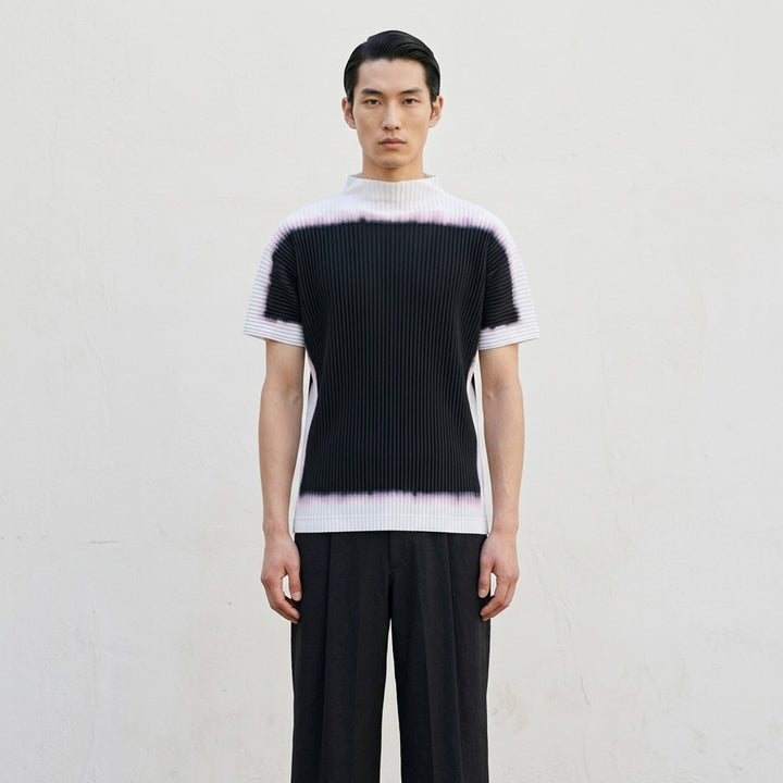 Back view of Homme Plissé Issey Miyake Framework : Chusen pleated short-sleeve top with high funnel neck and blurred black colour-block print edged in white and pink - lifestyle