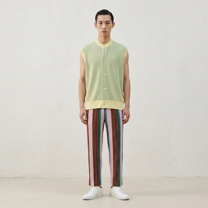 Homme Plissé Issey Miyake In The Shadow Knit sleeveless button-up cardigan in black and white vertical ribbed stripes - lifestyle