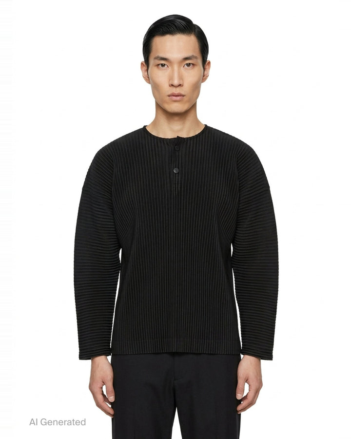 Homme Plissé Issey Miyake Monthly Colors September long-sleeve pleated top in black, featuring all-over accordion pleating and a tonal Henley button neckline - front