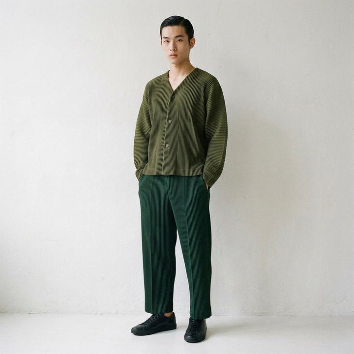 Homme Plissé Issey Miyake Slash Pleated Cardigan in olive green, featuring signature micro-pleating, V-neckline, and tonal button front closure - lifestyle