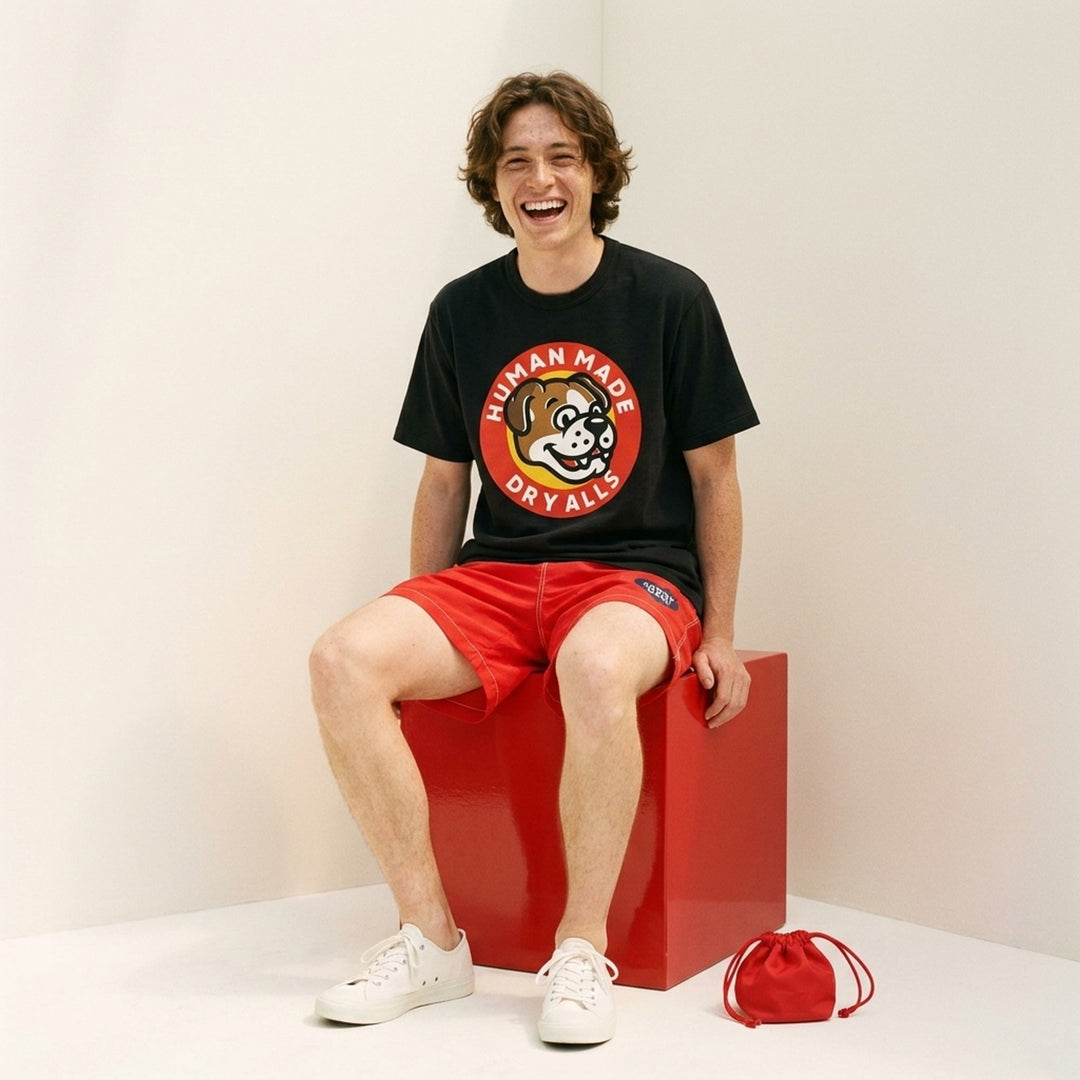 Human Made Dry Alls Graphic Tee in black, featuring a large circular bulldog mascot badge print at the chest with red, yellow, and white detailing - lifestyle