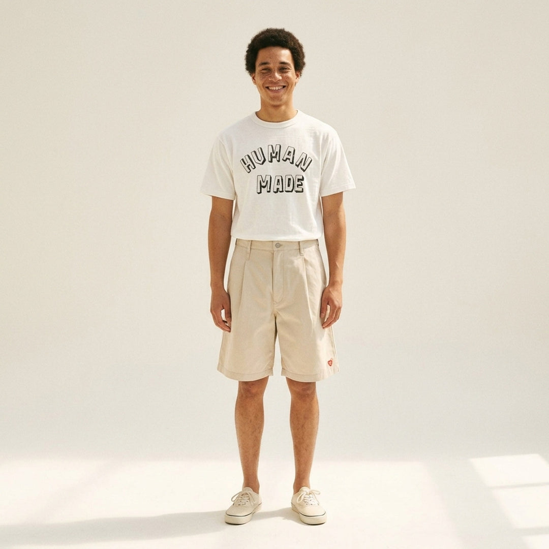 Human Made black short sleeve graphic t-shirt with white and grey hand-drawn arched logo print on the chest - lifestyle