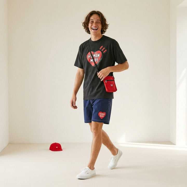 Human Made black short sleeve crew neck t-shirt with a large red hand-drawn heart graphic and 'Human Made' bubble lettering on the chest - lifestyle