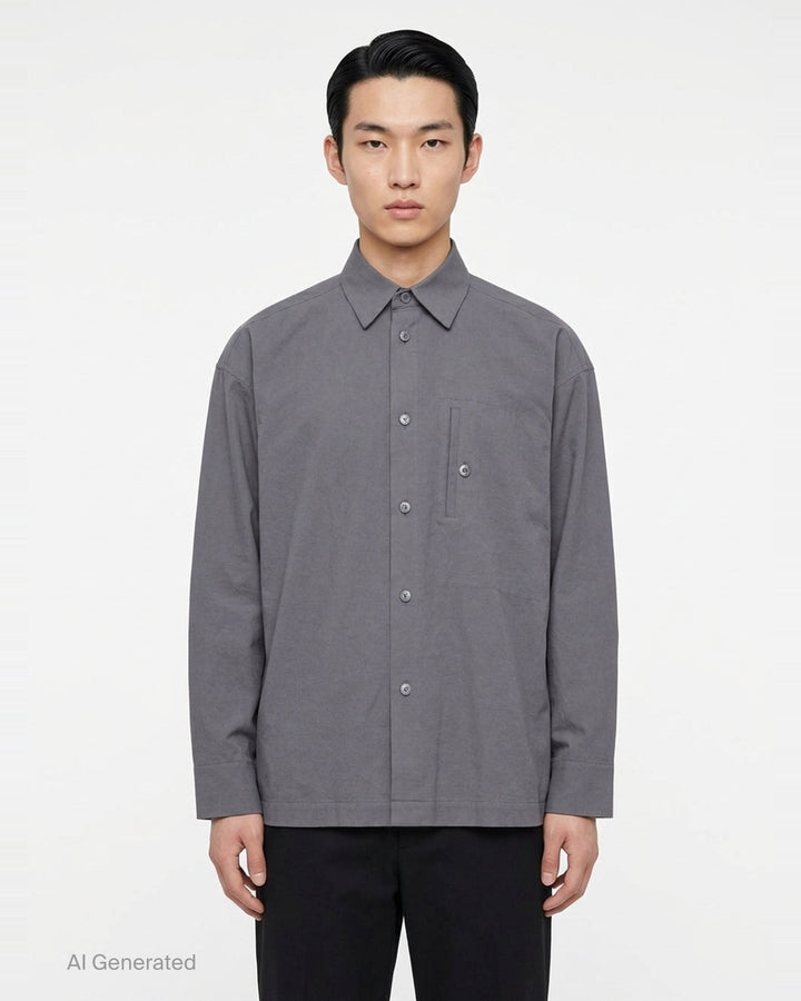 IM MEN Cotton Yak long sleeve overshirt in black with button-front closure, chest patch pocket, and hem patch pockets - front