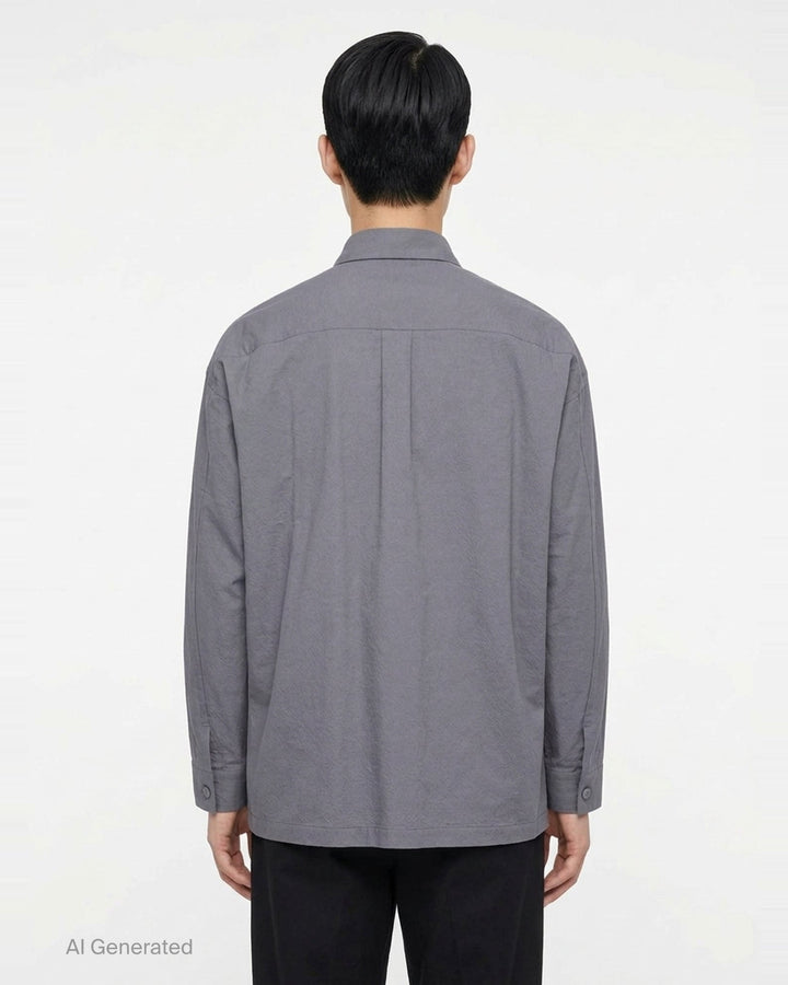 IM MEN Cotton Yak long sleeve overshirt in black with button-front closure, chest patch pocket, and hem patch pockets - back