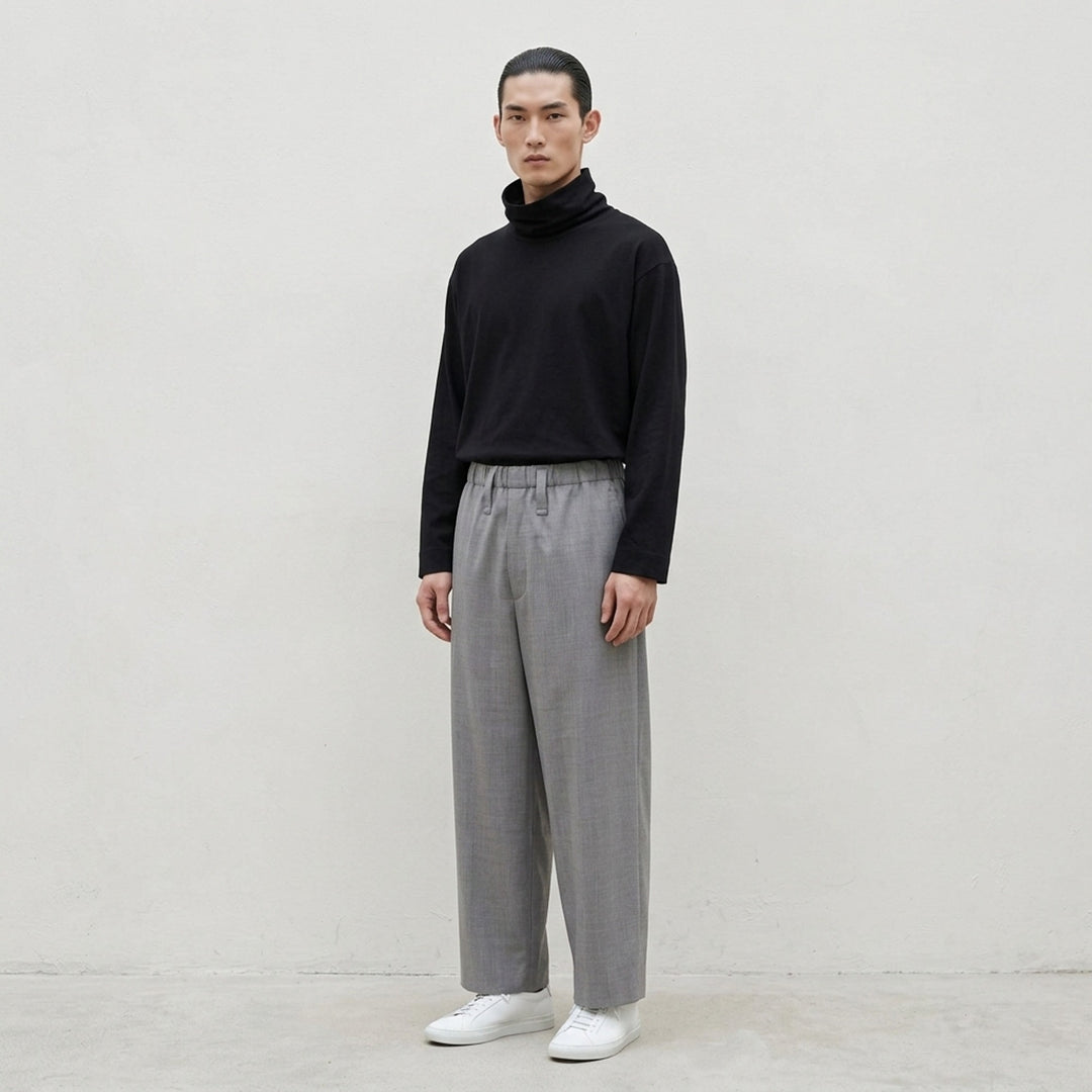 IM MEN Cotton Yak oversized long sleeve top in black with a dramatic gathered funnel neck, flat lay on white background - lifestyle