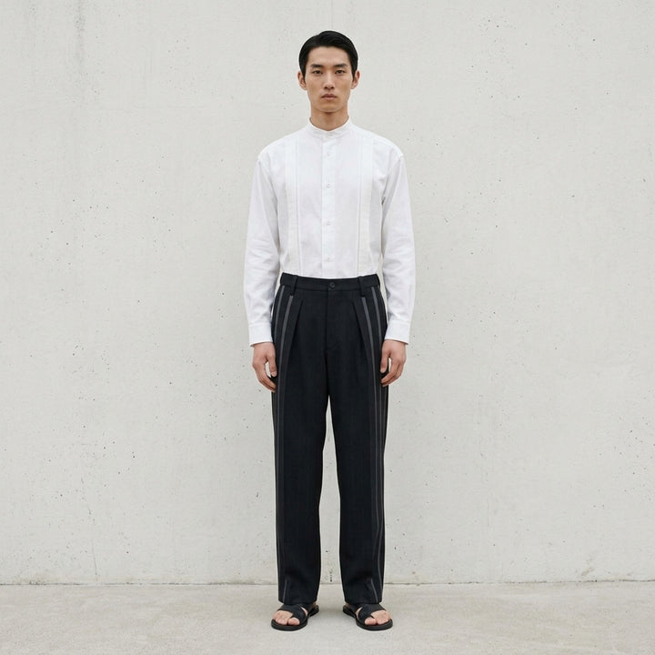 IM Men Dawn Ray black woven wide-leg pants with tonal contrast stripes running down both legs and a pleated front, flat lay on white background - lifestyle