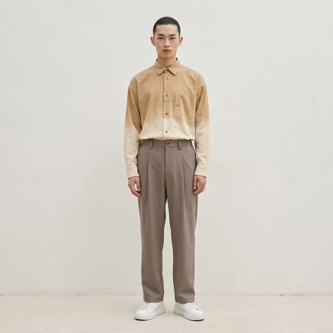 IM MEN FRONT BACK Woven Pants in taupe — relaxed wide-leg silhouette with double-pleat front, button waistband, and clean hemline, front view - lifestyle