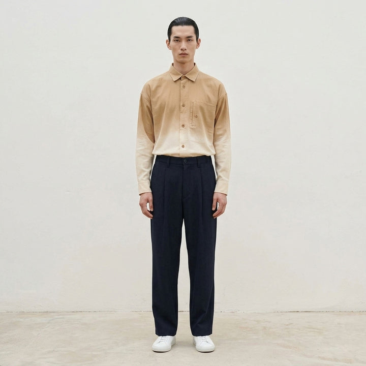 IM MEN FRONT BACK Woven Pants in taupe — relaxed wide-leg silhouette with double-pleat front, button waistband, and clean hemline, front view - lifestyle