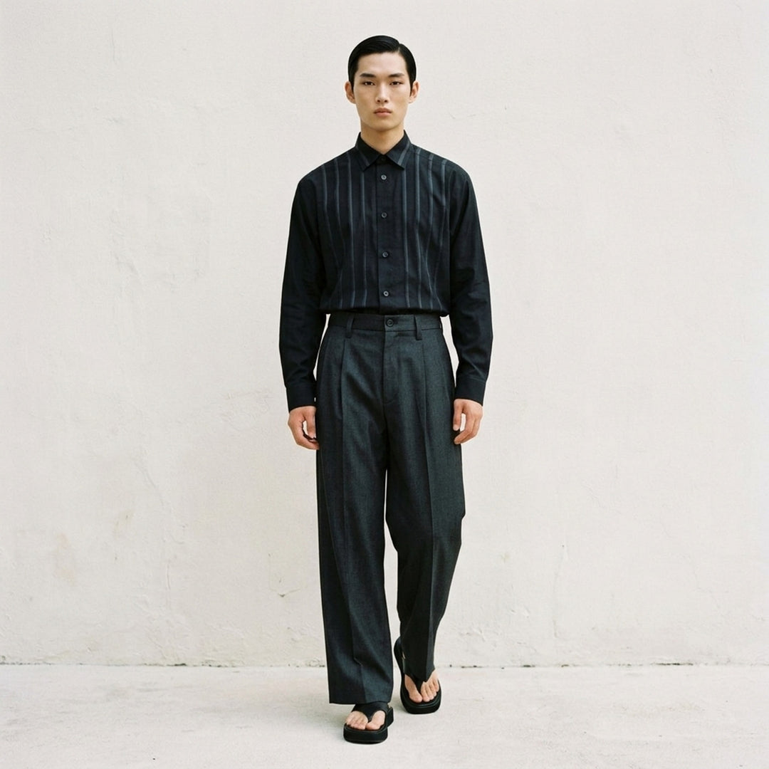 IM MEN Gradation Wool Pants in charcoal grey with front pleat, pressed crease and wide straight leg, shown from the front - lifestyle