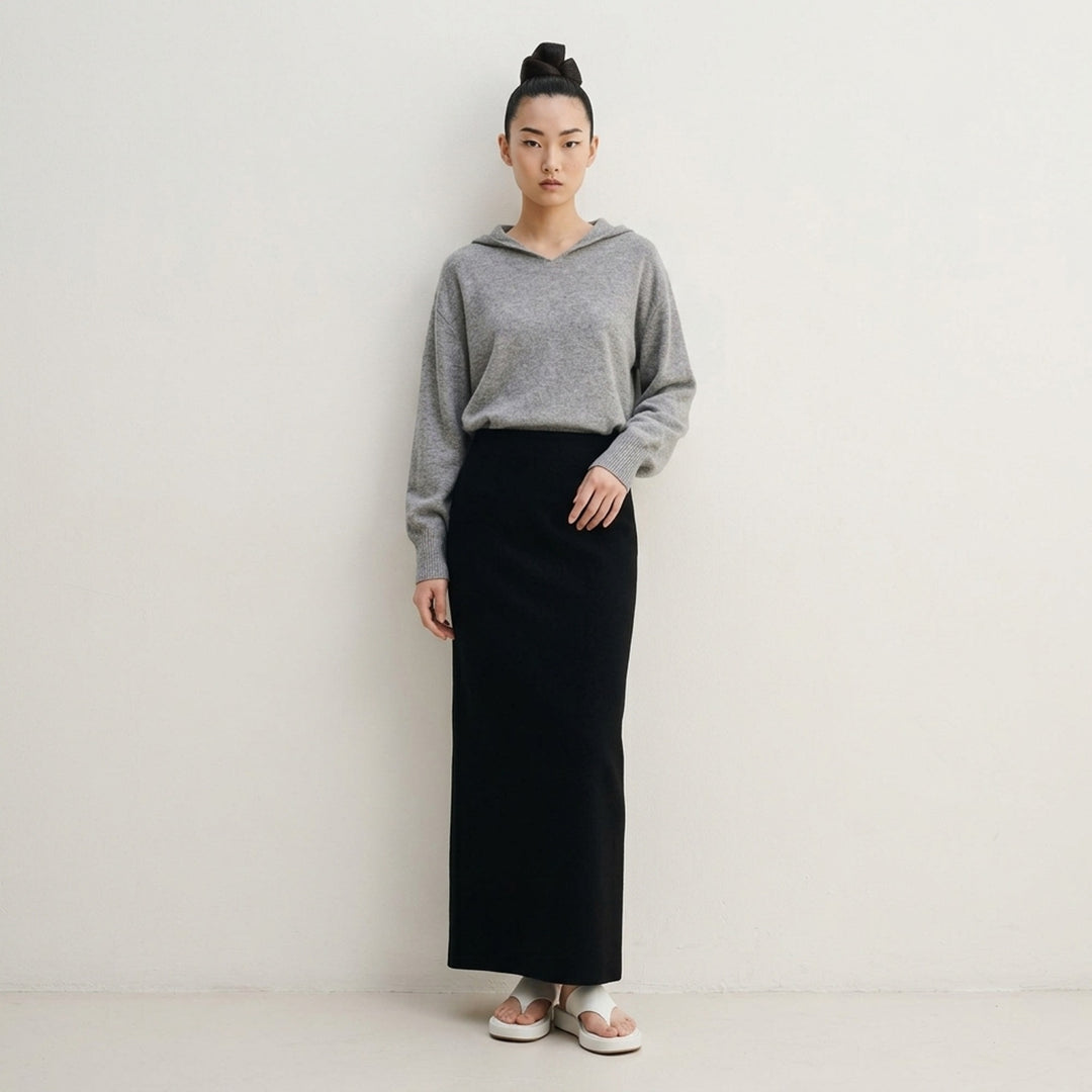 Issey Miyake CALLIGRAPH black maxi skirt with a high waist and slim-to-flared silhouette, photographed flat on a white background - lifestyle