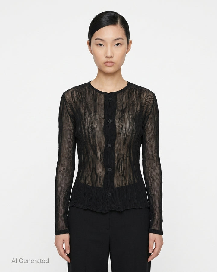 Issey Miyake sheer black chiffon twist cardigan with crinkled pleated texture, round neckline and button-front closure - front