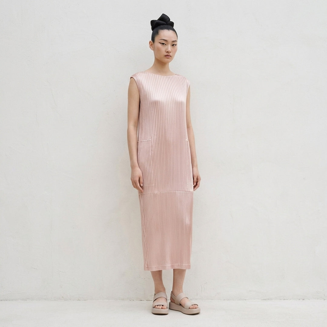Black sleeveless glossed pleated midi dress by Issey Miyake with a round neckline and paneled seams - lifestyle
