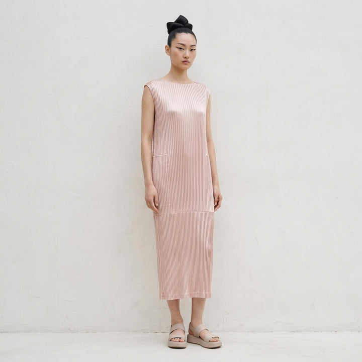 Black sleeveless glossed pleated midi dress by Issey Miyake with a round neckline and paneled seams - lifestyle