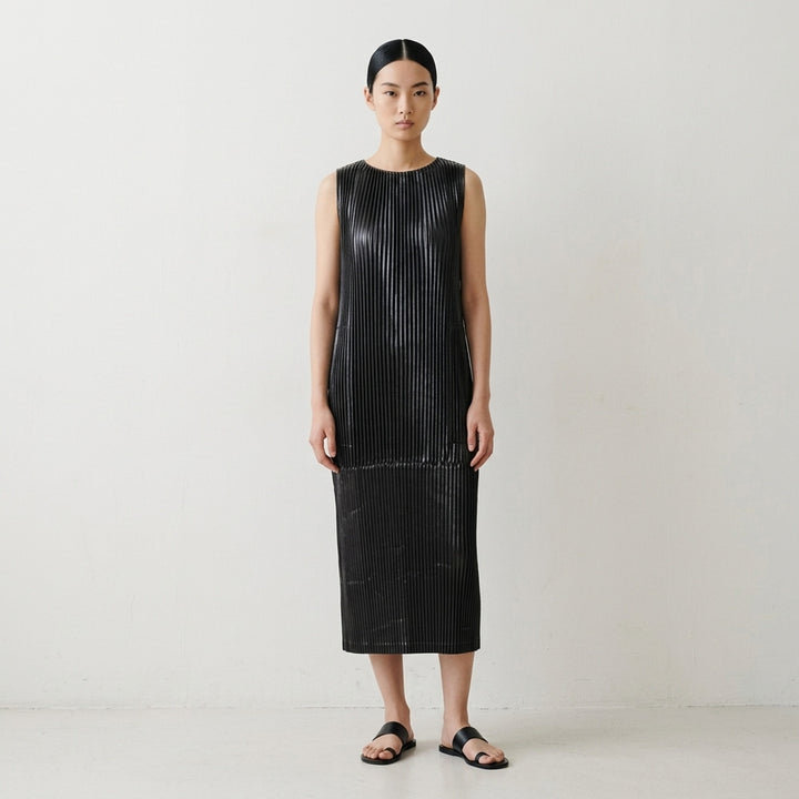 Black sleeveless glossed pleated midi dress by Issey Miyake with a round neckline and paneled seams - lifestyle