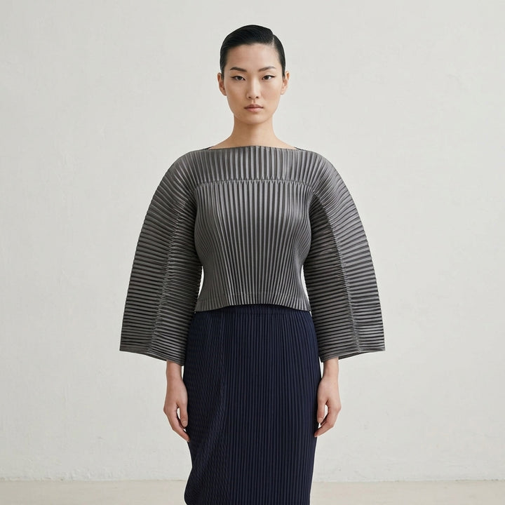 Issey Miyake glossed pleated off-the-shoulder cropped top in metallic grey with wide flared sleeves - lifestyle