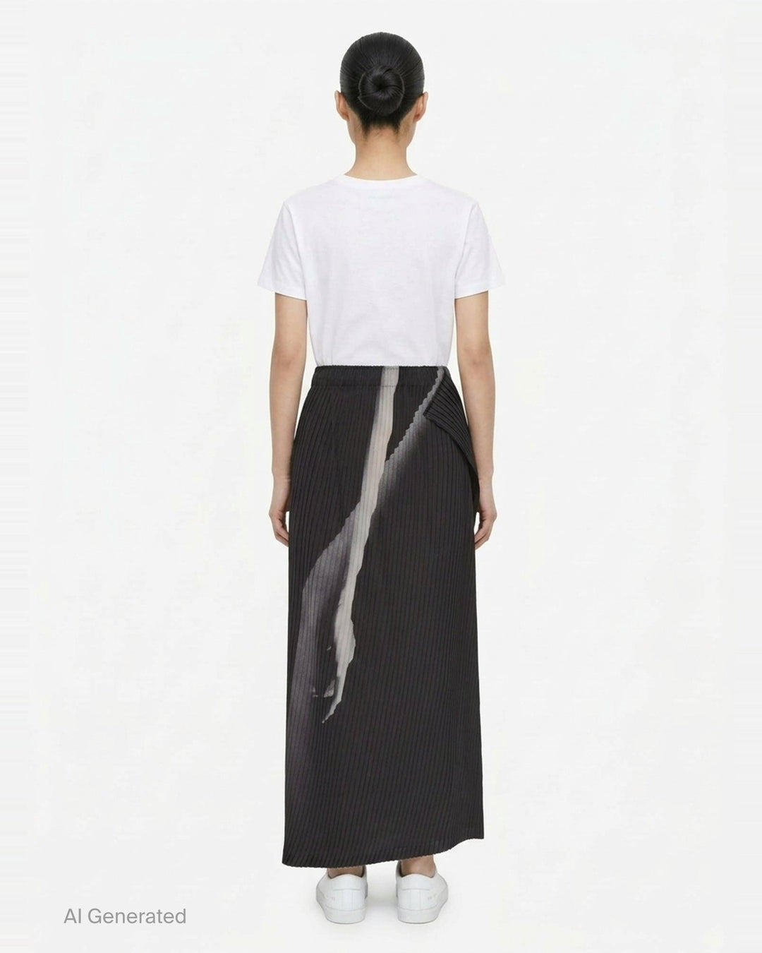 Issey Miyake Hands of Lover Pleats midi skirt in dark charcoal with abstract inkwash print and asymmetric wrap-front drape, shown in profile against a white background - back