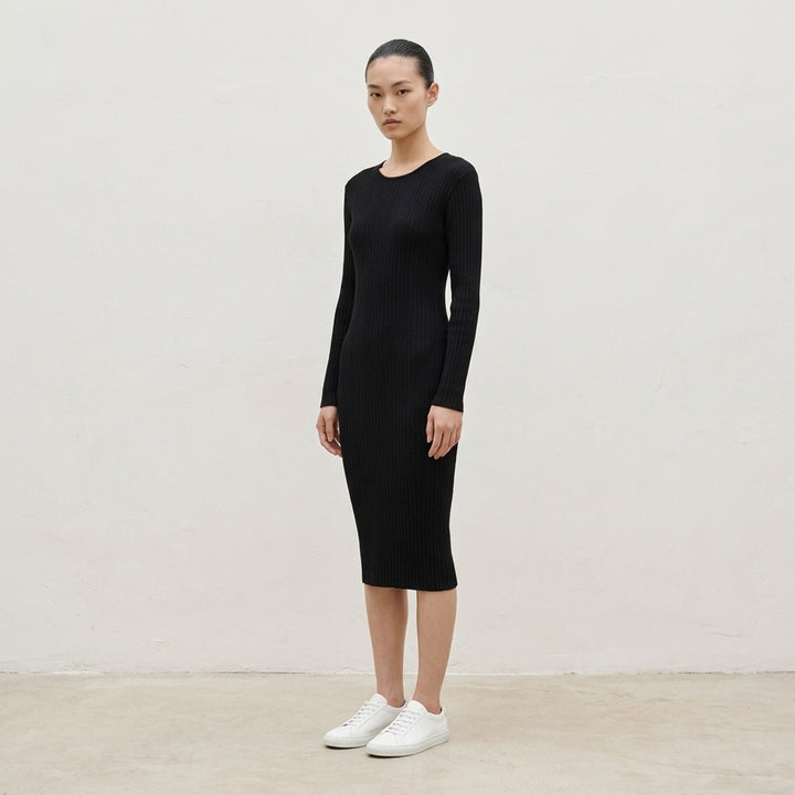 Issey Miyake Hatching Pleats black long-sleeve pleated midi dress with crew neckline, shown flat against a white background - lifestyle