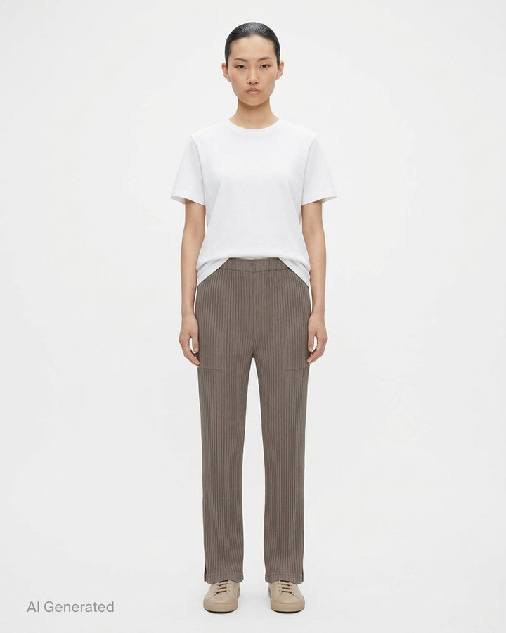 Issey Miyake Hatching Pleats pleated pants in muted taupe-grey with elasticated waist, patch pockets and straight leg, front view - front
