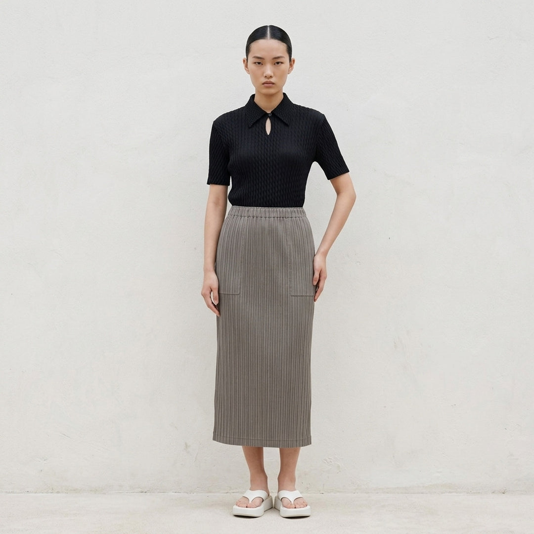 Issey Miyake Hatching Pleats black pleated midi skirt with elasticated waist, front view - lifestyle