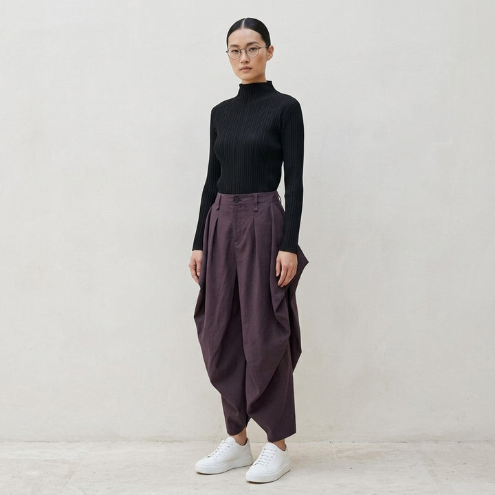 Issey Miyake Hatching Pleats black long sleeve mock-neck pleated top, front view - lifestyle