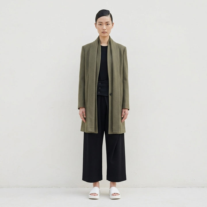 Issey Miyake Manner jacket in olive wool with integrated draped scarf collar and single button fastening - lifestyle