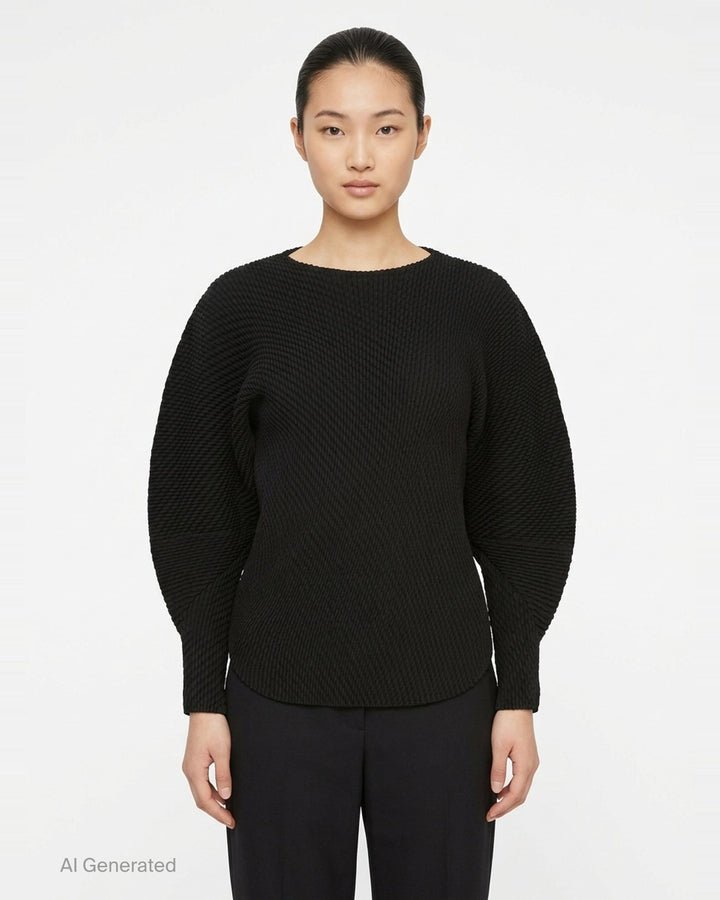 Issey Miyake Misty Pleats black pleated top, rear view, showing all-over relief pleat texture, batwing sleeves with fitted cuffs, and ribbed crew neckline - front