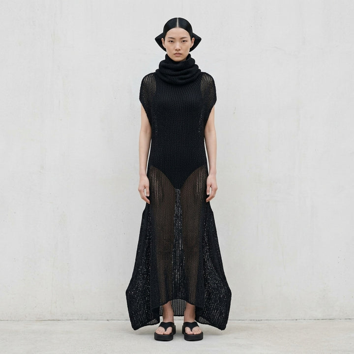 Issey Miyake Panini Pulled black sheer open-knit maxi dress with draped funnel neck, cap sleeves and curved flared hem - lifestyle