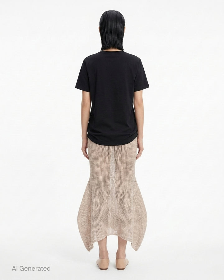 Issey Miyake Panini Pulled black open-weave sheer knit midi skirt with ribbed waistband and flared petal-shaped side panels, front view - back