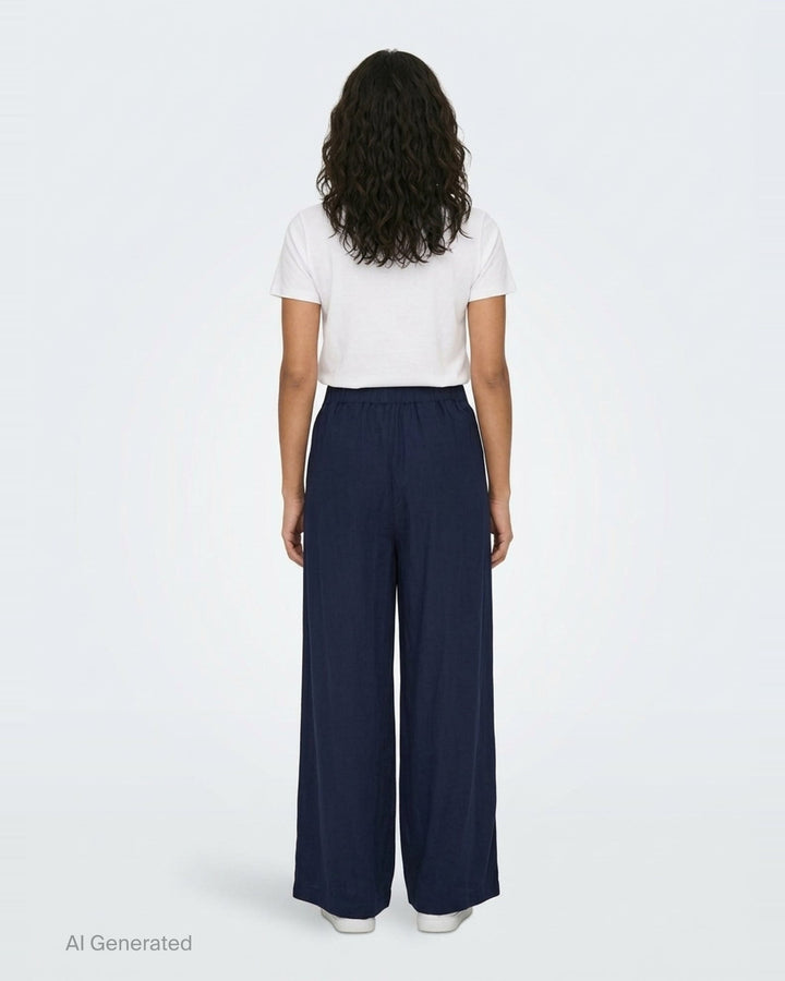 Lee Mathews Powell Wide Leg Pants in navy — high-waisted, elasticated waistband with front pleat detailing and a sweeping wide-leg silhouette - back