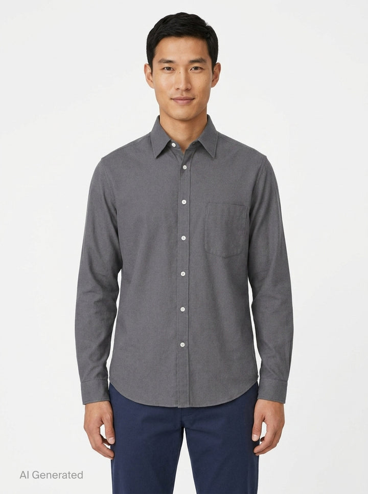 Lemaire Regular Long Sleeve Washed Cotton Shirt in slate grey, displayed flat against a white background, featuring a classic collar, white buttons, and a chest patch pocket - front