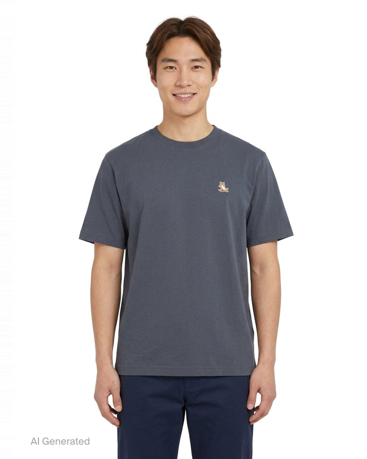 Maison Kitsuné Chillax Fox Comfort Tee in off-white with a small embroidered lounging fox patch on the chest, crew neck, and short sleeves - front