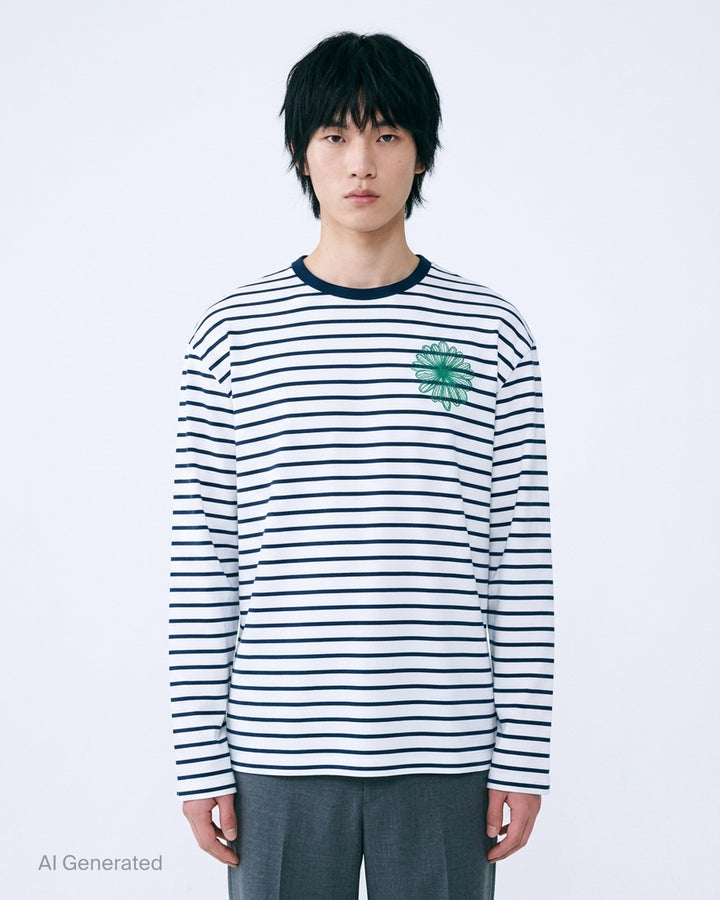 Mardi Mercredi long sleeve tee in white with navy horizontal stripes, a navy ribbed crew neck and an embroidered green flower at the chest - front