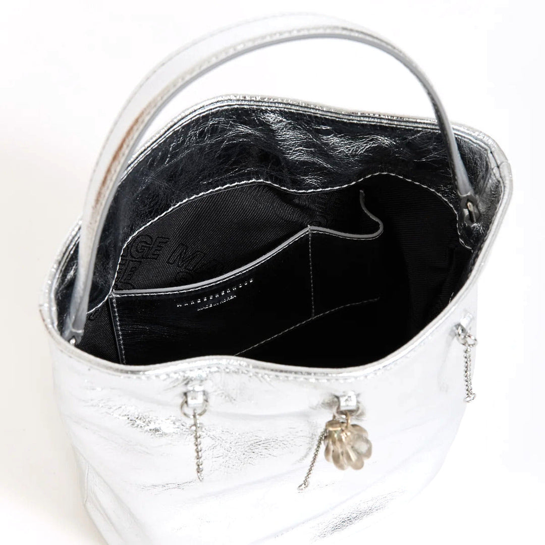 Marge Sherwood Wired Bucket Bag in crinkled metallic silver leather with a slim top handle and gold-tone charm on chain - packshot