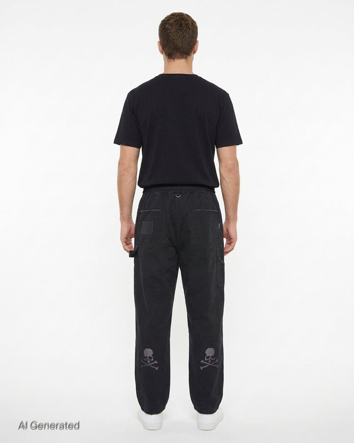 Mastermind stone washed straight easy pants in faded black with drawstring waist, hammer loop and branded cord detail - back