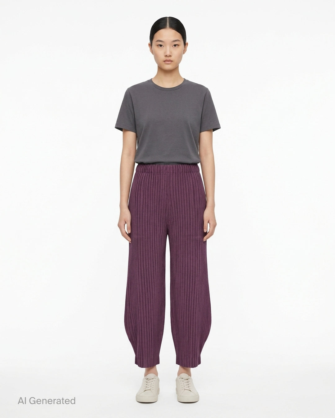 me Issey Miyake Corduroy Pleats black ribbed pleated pants with elasticated waist and curved, tapered leg, front view - front