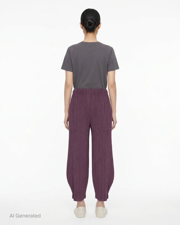 me Issey Miyake Corduroy Pleats black ribbed pleated pants with elasticated waist and curved, tapered leg, front view - back