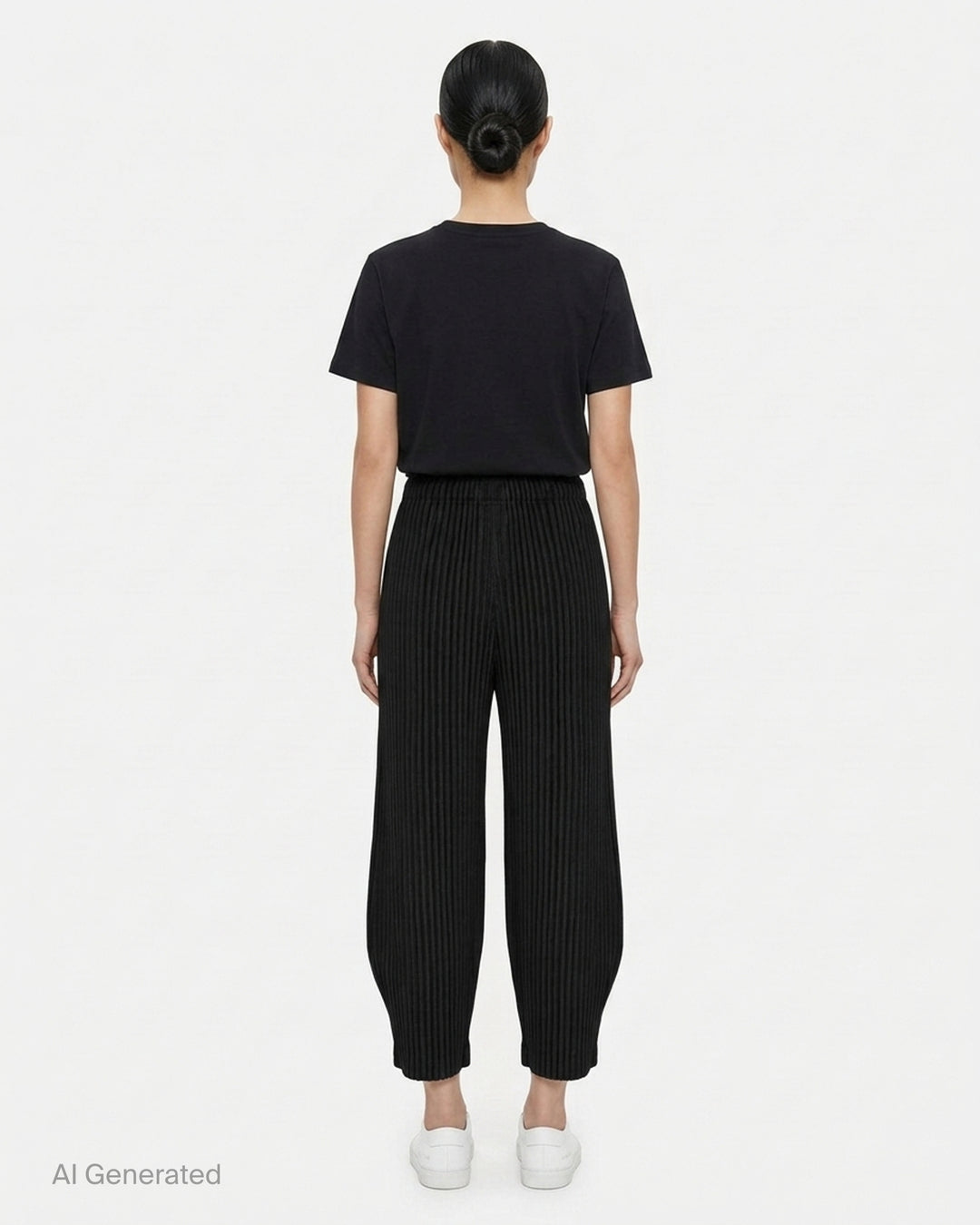 me Issey Miyake Corduroy Pleats black ribbed pleated pants with elasticated waist and curved, tapered leg, front view - back