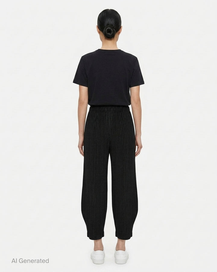 me Issey Miyake Corduroy Pleats black ribbed pleated pants with elasticated waist and curved, tapered leg, front view - back