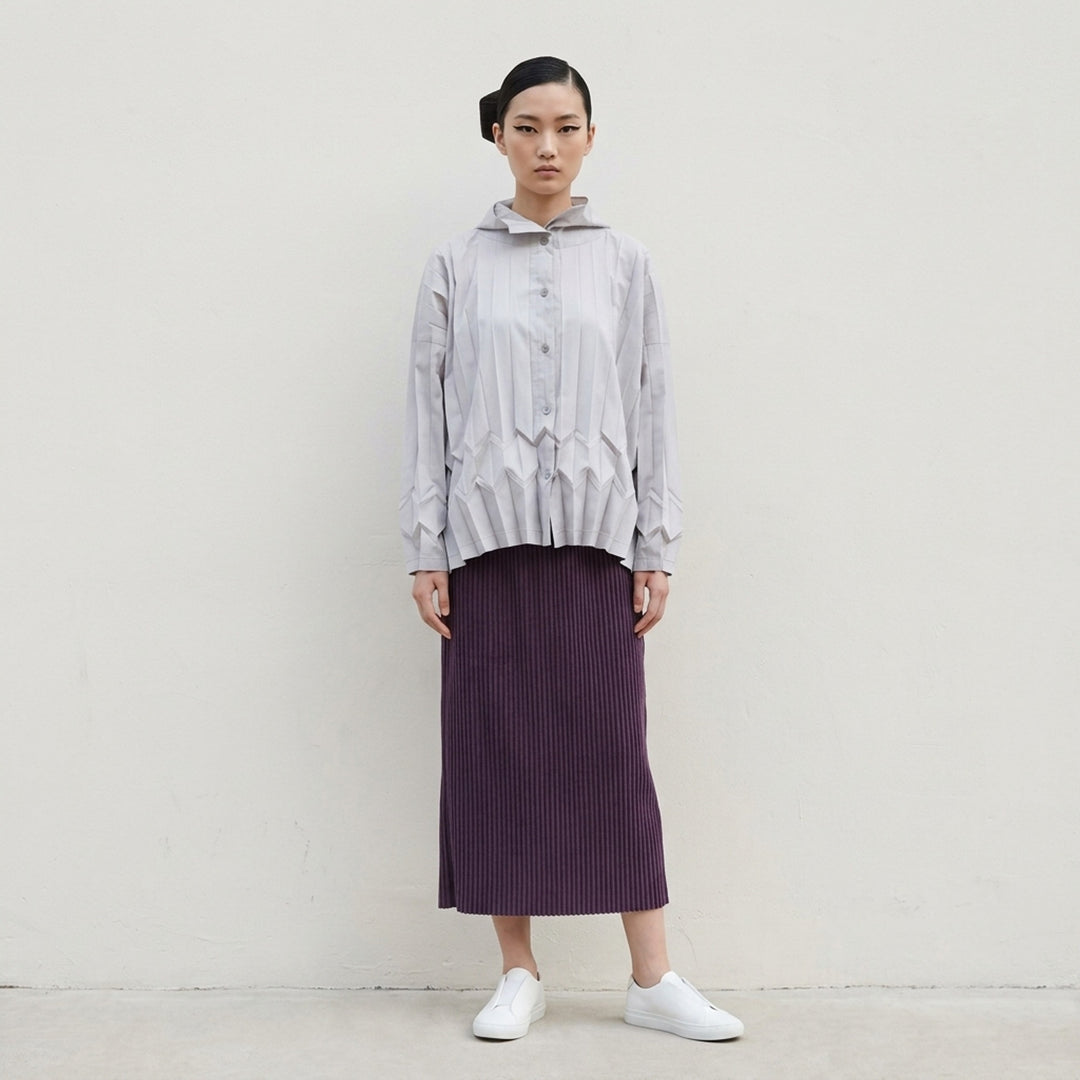 me Issey Miyake Corduroy Pleats midi skirt in plum purple with fine vertical ribbed pleats and an elasticated waistband, shown front view - lifestyle