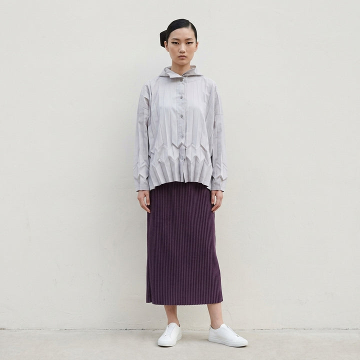 me Issey Miyake Corduroy Pleats midi skirt in plum purple with fine vertical ribbed pleats and an elasticated waistband, shown front view - lifestyle