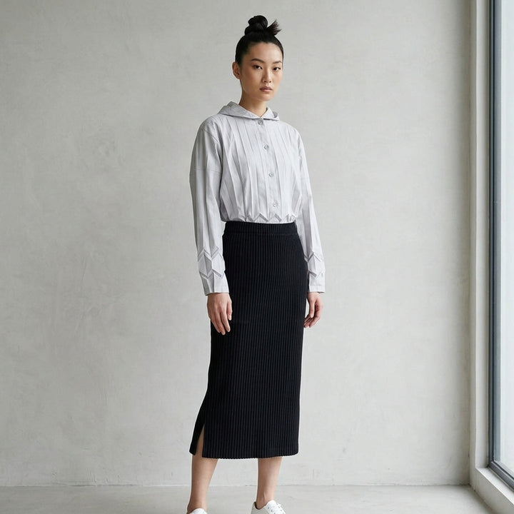 me Issey Miyake Corduroy Pleats midi skirt in plum purple with fine vertical ribbed pleats and an elasticated waistband, shown front view - lifestyle