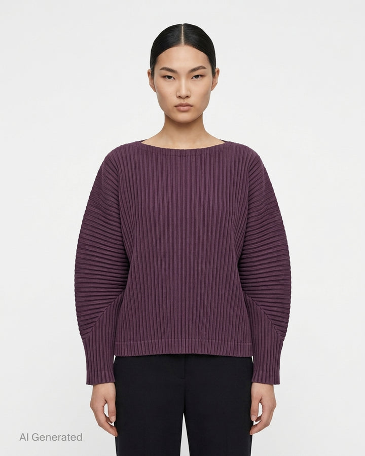 me Issey Miyake Corduroy Pleats long sleeve top in black with boat neckline, sculpted pleated sleeves and cross-stitch detail at the neck - front