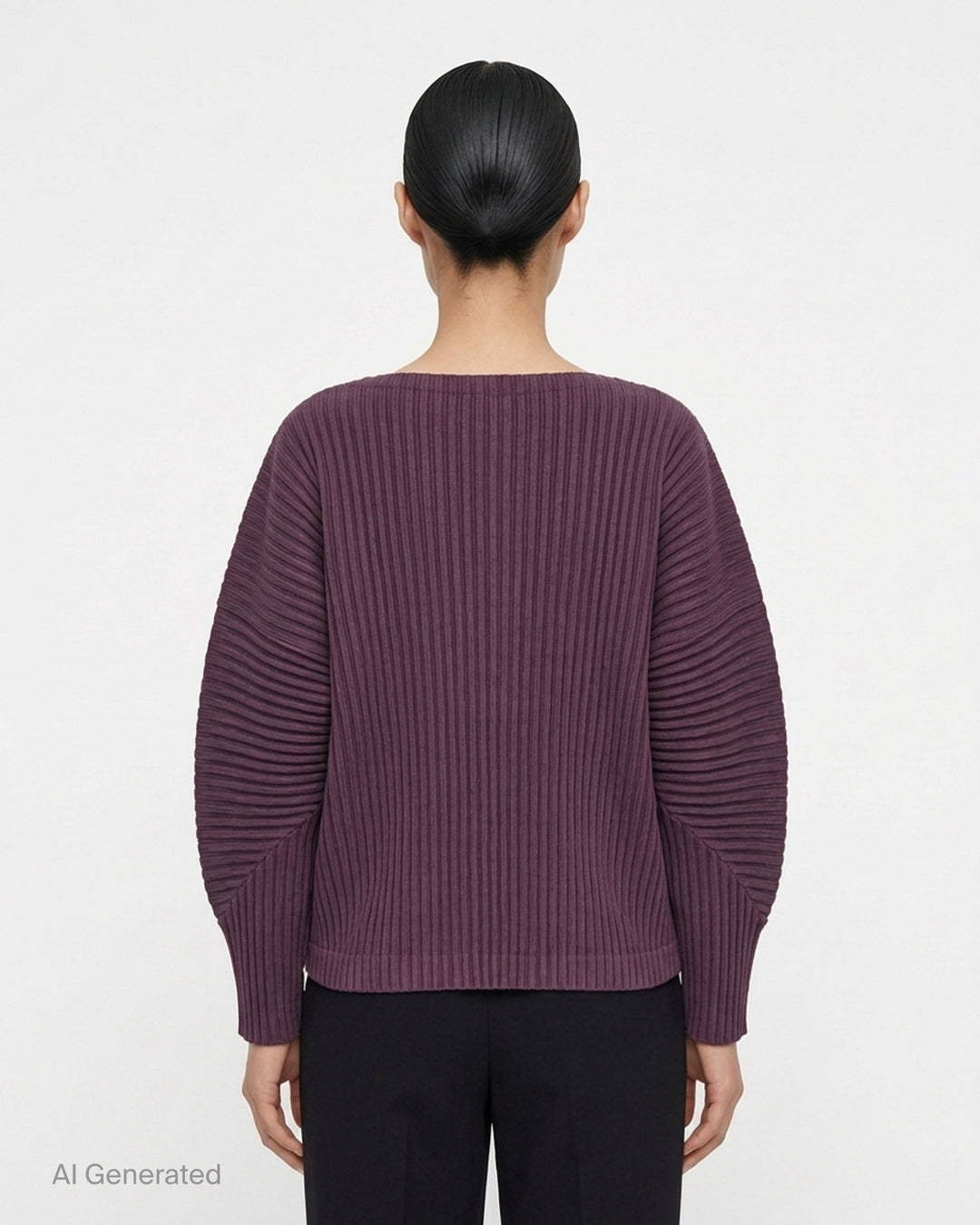 me Issey Miyake Corduroy Pleats long sleeve top in black with boat neckline, sculpted pleated sleeves and cross-stitch detail at the neck - back