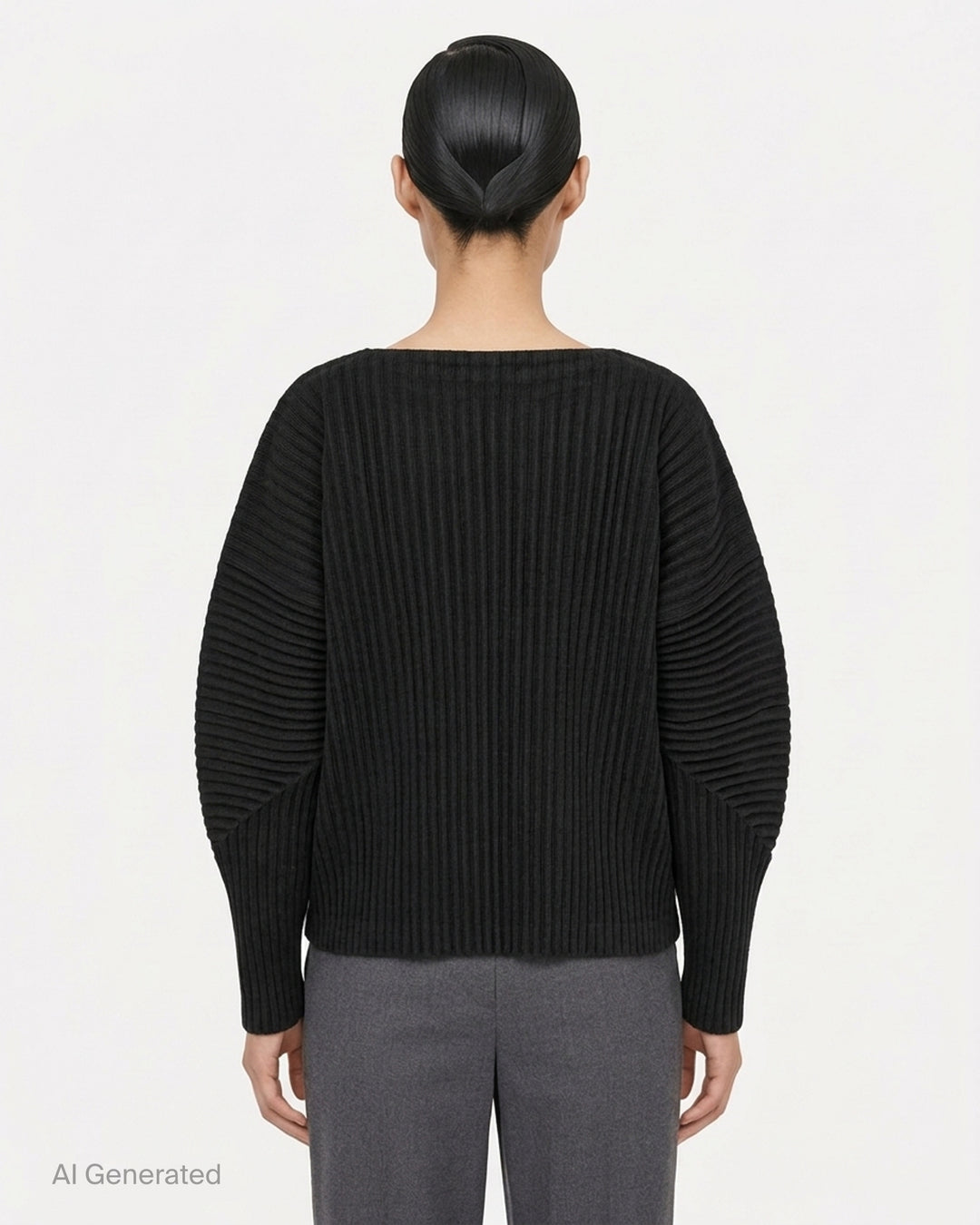 me Issey Miyake Corduroy Pleats long sleeve top in black with boat neckline, sculpted pleated sleeves and cross-stitch detail at the neck - back