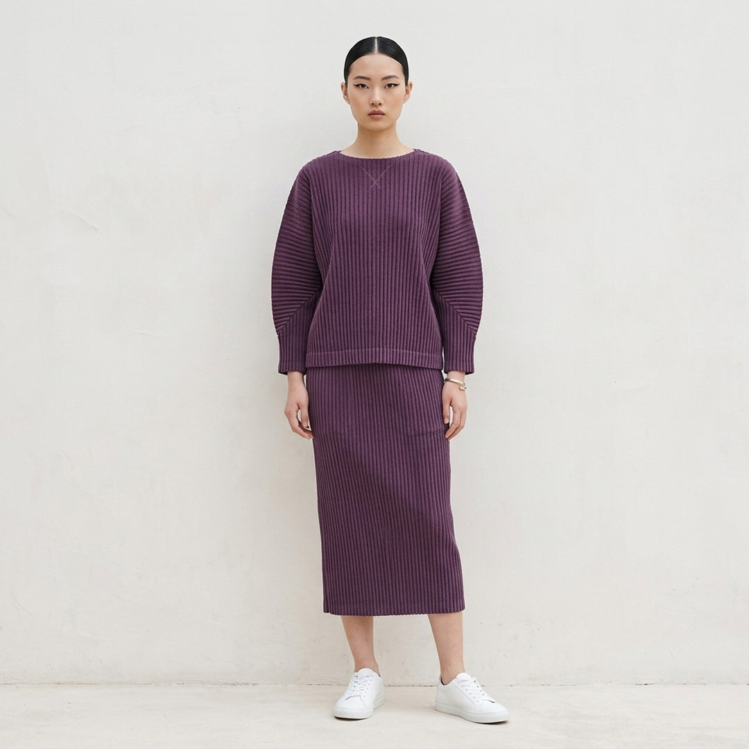 me Issey Miyake Corduroy Pleats long sleeve top in black with boat neckline, sculpted pleated sleeves and cross-stitch detail at the neck - lifestyle